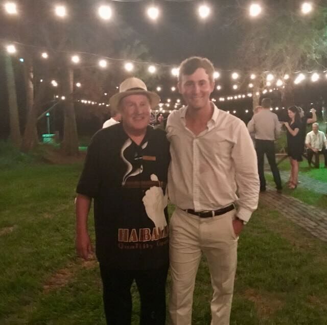 Joe with a guest at a golf tournament