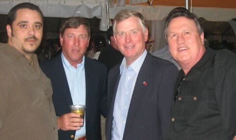Joe with guests at an evening reception