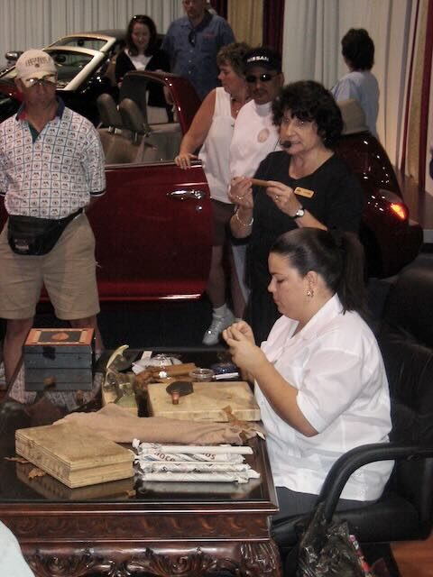 Elaine hand-rolling a cigar