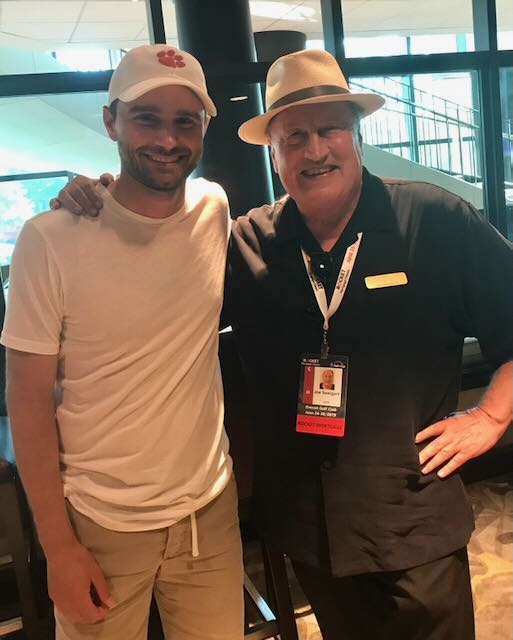 Joe with a guest at a golf tournament