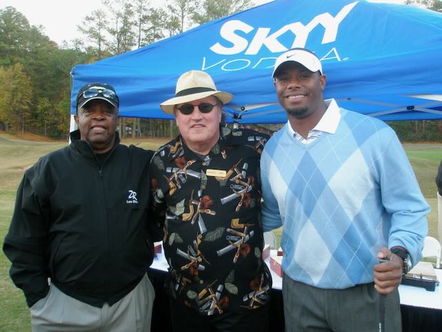 Joe with guests at a golf tournament cigar tent