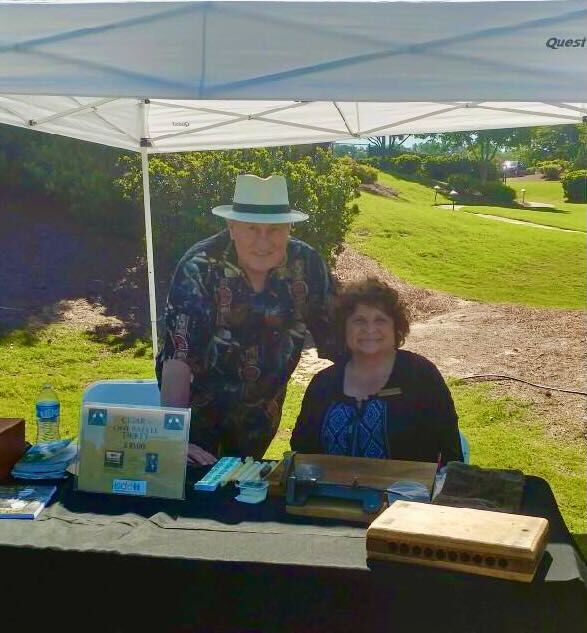Joe and Elaine with a guest and his humidor at a coastal reception