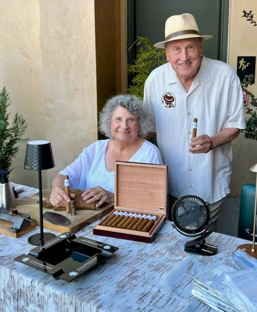 Joe and Jorge at a cigar table